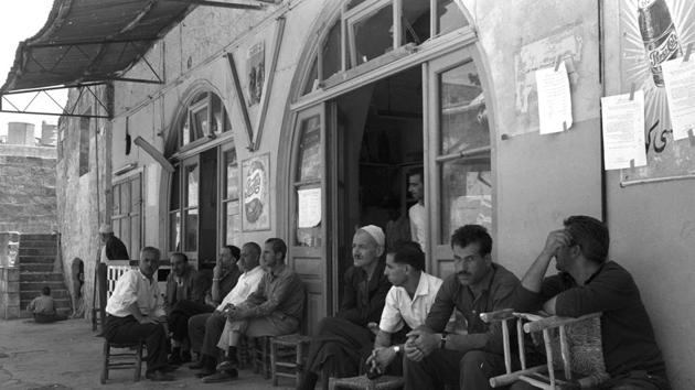 BEFORE: Men sit at a sidewalk cafe in Jerusalem's Old City. For Palestinians, East Jerusalem is a symbol of their national struggle and home to Islam’s third most sacred site, the al-Aqsa mosque, and the nearby glittering Dome of the Rock. (REUTERS)