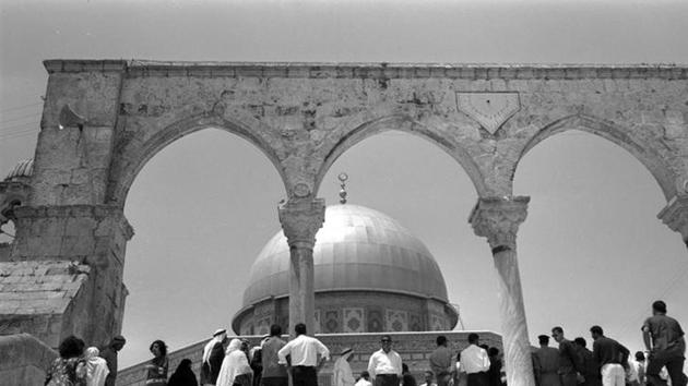 BEFORE: Palestinians stand in front of the Dome of the Rock on the compound known to Muslims as Noble Sanctuary and to Jews as Temple Mount. (Reuters)