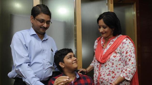 Aditya Sharma with his parents. (Deepak Gupta/HT Photo) Aditya Sharma with his parents. (Deepak Gupta/HT Photo)