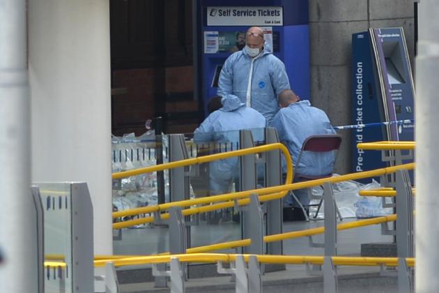 Forensics officers work at the scene at Manchester Victoria station in central Manchester, northwest England on May 23, 2017 following a deadly terror attack at a concert at the exit of the adjoining Manchester Arena the night before. (Ben Stansall/AFP)