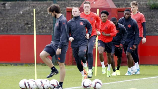 Manchester United's Wayne Rooney, second left, attends a training session ahead of their Europa League final against Ajax. (AP) Manchester United's Wayne Rooney, second left, attends a training session ahead of their Europa League final against Ajax. (AP)