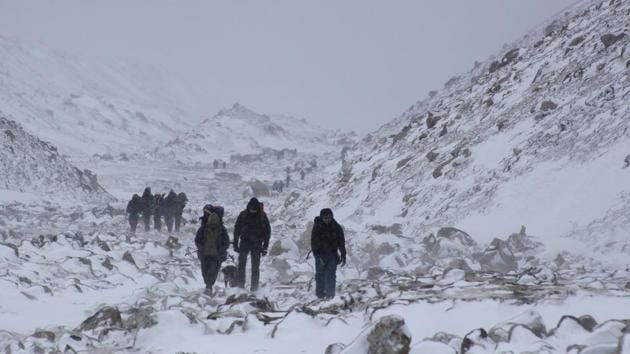 In this March 11, 2017 file photo, trekkers hike towards Everest Base camp near Lobuche, Nepal. Mountaineering expedition organizers in Nepal are sending huge trash bags with climbers on Mount Everest during the spring climbing season to collect trash that then can be winched by helicopters back to the base camp. (AP)