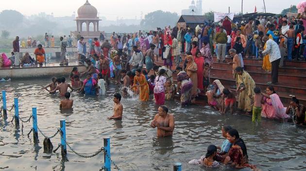 A new CAG report has pointed to the Gomti River in Lucknow being more polluted than the Ganga in Varanasi. The CAG, which studied the pollution levels in the two cities from 2011 to 2015, said the temple town Varanasi, despite having a higher population density, had performed better than state capital Lucknow with regard to water and air pollution and solid waste. Seen above are people taking a holy dip in the Kuriyan Ghat, Gomti River in old Lucknow during a festival. (Dheeraj Dhawan/HT)