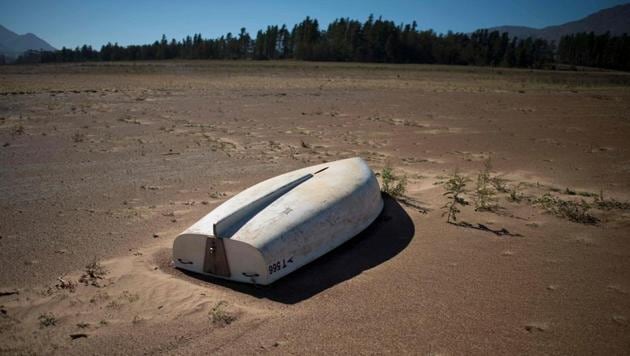 A boat lying on the sand at the Theewaterskloof Dam, which has less than 20% of it's water capacity, near Villiersdorp, about 108 km from Cape Town. This dam is the main water source for the city of Cape Town, and there is only 10% of it's usual capacity left for human consumption, at the last 10% is not useable, due to the silt content. The Western Cape Province, which includes Cape Town is suffering from one of the worst water shortages in living memory. This has necessitated the Cape Town City Councel to establish stringent water usage restrictions, and unless unexpectedly heavy rains fall soon, the province will begin a cycle of drought. (Rodger Bosch / AFP) A boat lying on the sand at the Theewaterskloof Dam, which has less than 20% of it's water capacity, near Villiersdorp, about 108 km from Cape Town. This dam is the main water source for the city of Cape Town, and there is only 10% of it's usual capacity left for human consumption, at the last 10% is not useable, due to the silt content. The Western Cape Province, which includes Cape Town is suffering from one of the worst water shortages in living memory. This has necessitated the Cape Town City Councel to establish stringent water usage restrictions, and unless unexpectedly heavy rains fall soon, the province will begin a cycle of drought. (Rodger Bosch / AFP)
