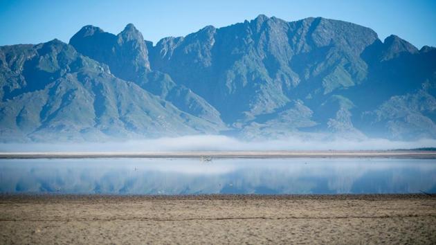 A bare sand and a narrow body of water facing the sky at Theewaterskloof Dam. (Rodger Bosch / AFP) A bare sand and a narrow body of water facing the sky at Theewaterskloof Dam. (Rodger Bosch / AFP)