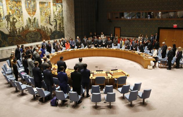 Members of the united Nations Security Council observe a moment of silence for the victims of the terrorist attack in Manchester, England, before a meeting at UN headquarters, Tuesday. (Seth Wenig/AP Photo)