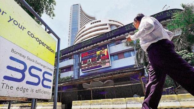 A man walks past the BSE in Mumbai. (PTI photo) A man walks past the BSE in Mumbai. (PTI photo)