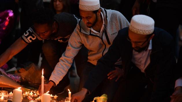 People light candles set up in front of floral tributes in Albert Square in Manchester on May 23 in solidarity with those killed and injured in the terror attack at the Ariana Grande concert at the Manchester Arena. (AFP Photo) People light candles set up in front of floral tributes in Albert Square in Manchester on May 23 in solidarity with those killed and injured in the terror attack at the Ariana Grande concert at the Manchester Arena. (AFP Photo)