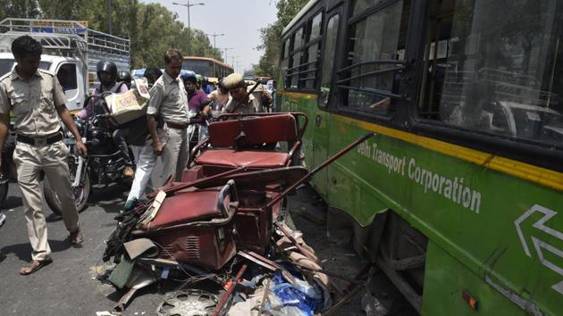 A DTC bus hit two e-rickshaws and an auto in Azadpur killing two people in Azadpur on Wednesday. Police suspect the driver lost control over the bus after a tyre burst. (Sushil Kumar/HT Photo) A DTC bus hit two e-rickshaws and an auto in Azadpur killing two people in Azadpur on Wednesday. Police suspect the driver lost control over the bus after a tyre burst. (Sushil Kumar/HT Photo)
