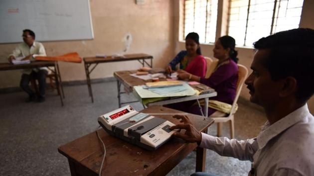 Voting officials oversee last-minute preparations before the elections at Kharghar in Navi Mumbai on Tuesday. (Bachchan Kumar) Voting officials oversee last-minute preparations before the elections at Kharghar in Navi Mumbai on Tuesday. (Bachchan Kumar)