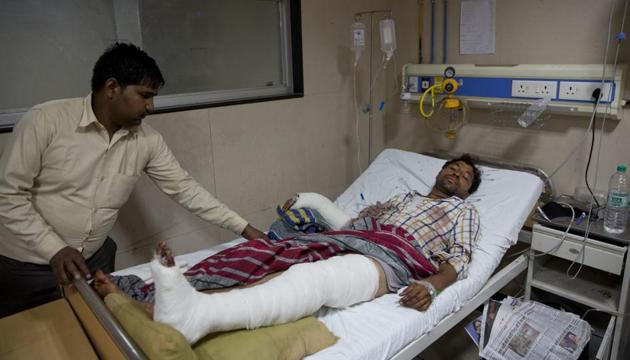 A relative attends to Rajesh Kumar, 28, who was attacked by a group of people while returning from a rally, at a government hospital in Meerut.Dalits were attacked while they were returning from a rally led by their leader Mayawati in Saharanpur, a town in Uttar Pradesh state. (AP Photo) A relative attends to Rajesh Kumar, 28, who was attacked by a group of people while returning from a rally, at a government hospital in Meerut.Dalits were attacked while they were returning from a rally led by their leader Mayawati in Saharanpur, a town in Uttar Pradesh state. (AP Photo)