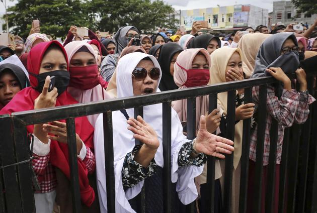 Muslim women observers cheered as the caning took place. (AP)