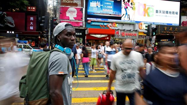 Solomon Nyassi poses on a street at Tsim Sha Tsui. Medard Koya said the team aimed to promote solidarity and provide hope for other asylum seekers facing an uncertain future far from home. (Bobby Yip/REUTERS) Solomon Nyassi poses on a street at Tsim Sha Tsui. Medard Koya said the team aimed to promote solidarity and provide hope for other asylum seekers facing an uncertain future far from home. (Bobby Yip/REUTERS)