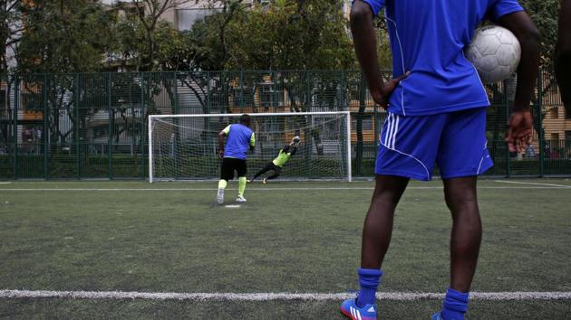 Members of All Black FC take part in a training session in Hong Kong, China. Twice a week, this group of mostly African asylum-seekers gathers on a soccer pitch in Hong Kong and trains for its next match against a local side. (Bobby Yip/REUTERS) Members of All Black FC take part in a training session in Hong Kong, China. Twice a week, this group of mostly African asylum-seekers gathers on a soccer pitch in Hong Kong and trains for its next match against a local side. (Bobby Yip/REUTERS)