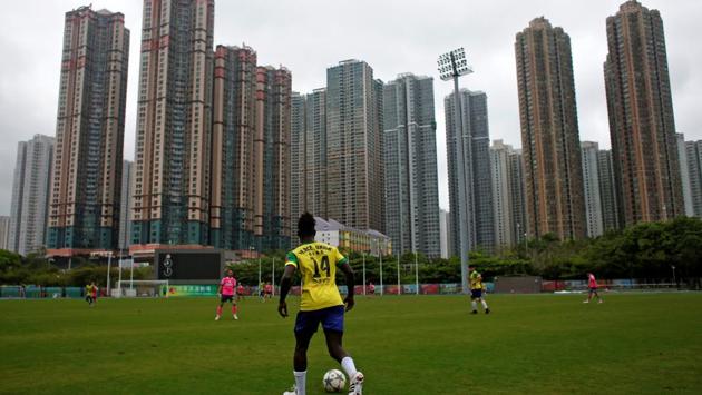 Solomon Nyassi, 26, from Gambia, a member of All Black FC, plays for a local team during a friendly match. Solomon was on a business trip to Hong Kong three years ago when his father warned him it was too dangerous to return to Gambia in west Africa. (Bobby Yip/REUTERS) Solomon Nyassi, 26, from Gambia, a member of All Black FC, plays for a local team during a friendly match. Solomon was on a business trip to Hong Kong three years ago when his father warned him it was too dangerous to return to Gambia in west Africa. (Bobby Yip/REUTERS)
