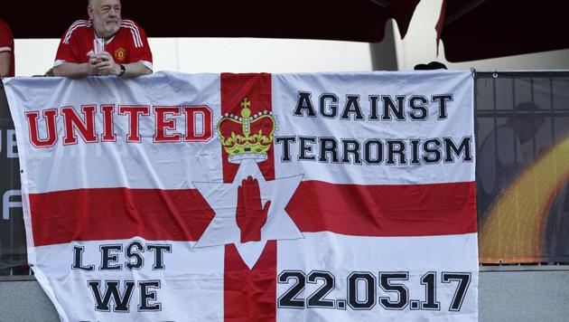 Manchester United fans display a banner in reference to the terror attack in Manchester before their Europa League final against Ajax.(REUTERS)