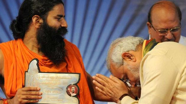 Prime Minister Narendra Modi and yoga guru Baba Ramdev.(AFP File Photo)