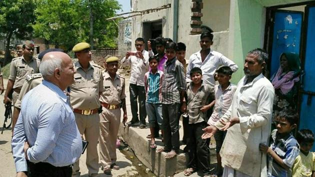 Home secretary Mani Prasad Mishra and ADG (law and order) Aditya Mishra interacting with people in violence-hit villages. (HT Photo) Home secretary Mani Prasad Mishra and ADG (law and order) Aditya Mishra interacting with people in violence-hit villages. (HT Photo)