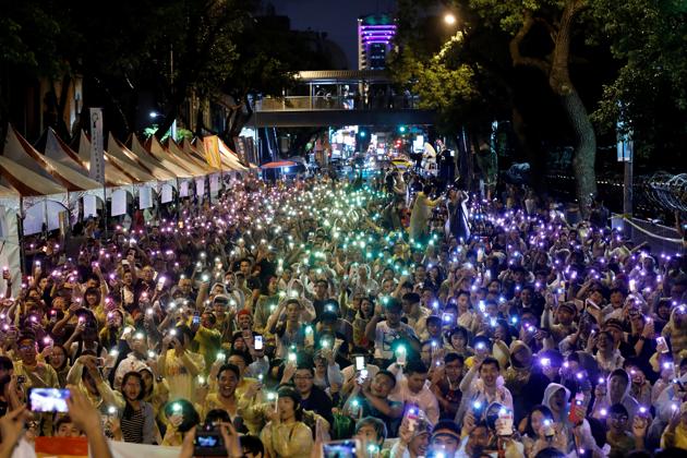 Supporters wave their mobile phone torches in the colors of the rainbow. It gave the government two years to implement the ruling. (Tyrone Siu/REUTERS) Supporters wave their mobile phone torches in the colors of the rainbow. It gave the government two years to implement the ruling. (Tyrone Siu/REUTERS)