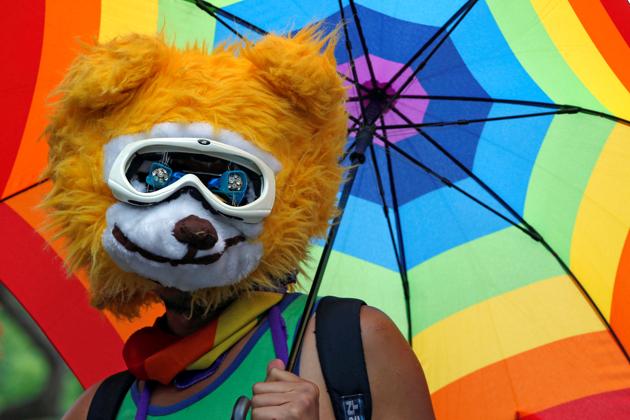 A supporter holds a rainbow umbrella during the rally. Taiwan’s top court ruled in favour of gay marriage on Wednesday, a landmark decision that paves the way for the island to become the first place in Asia to legalise same-sex unions. (Tyrone Siu/REUTERS) A supporter holds a rainbow umbrella during the rally. Taiwan’s top court ruled in favour of gay marriage on Wednesday, a landmark decision that paves the way for the island to become the first place in Asia to legalise same-sex unions. (Tyrone Siu/REUTERS)