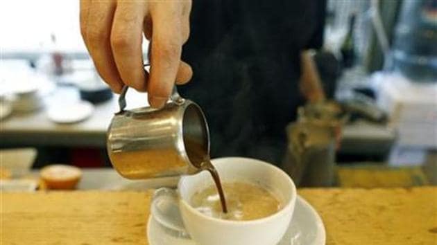 A waiter prepares cappuccino at a coffee shop.(Reuters photo)