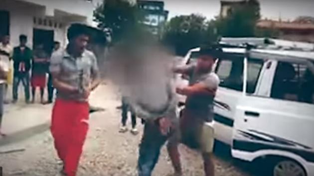 The owner of the house where the boy was working called a few people in the area. They tied the boy up, thrashed him with sticks and kicked him. (Video grab) The owner of the house where the boy was working called a few people in the area. They tied the boy up, thrashed him with sticks and kicked him. (Video grab)