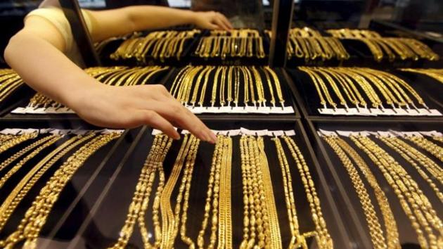 Spot gold was nearly flat at $1,258.61 per ounce. (Reuters photo) Spot gold was nearly flat at $1,258.61 per ounce. (Reuters photo)