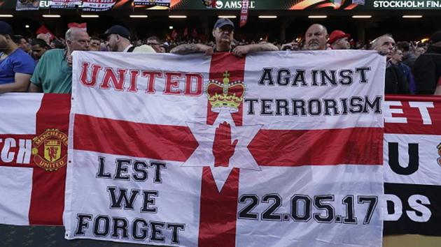 Manchester United fans hold up banners, in honour of the victims of the Manchester terrorism attack, during the UEFA Europa League final between Ajax and Man United at Friends Arena in Stockholm on Wednesday. (Getty Images)