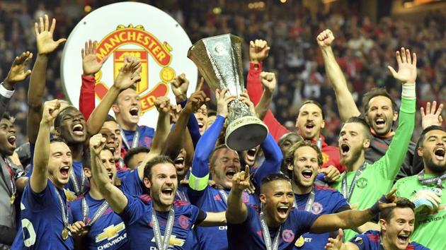 Manchester United players celebrate with the trophy after winning the UEFA Europa League crown, beating Ajax Amsterdam in the final at Friends Arena in Stockholm on Wednesday. Manchester United won 2-0 with Paul Pogba and Henrikh Mkhitaryan scoring for the English side. (AP)