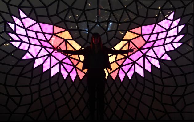 A woman poses in front of a light installation on the eve of the Vivid Sydney festival . Vivid Sydney, an annual festival of light, music and ideas, runs this year from May 26 to June 19. (SAEED KHAN / AFP) A woman poses in front of a light installation on the eve of the Vivid Sydney festival . Vivid Sydney, an annual festival of light, music and ideas, runs this year from May 26 to June 19. (SAEED KHAN / AFP)