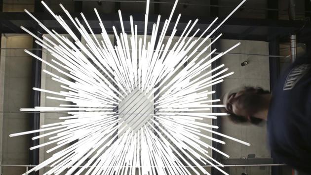Nico Locane, co-creator of ‘Parallax,’ stands under the installation of 492 extrusions of 11 different lengths that go through a series of illumination over 8 to 10 minutes during a preview of Vivid, a festival of light, music and ideas, in Sydney. (Rick Rycroft / AP) Nico Locane, co-creator of ‘Parallax,’ stands under the installation of 492 extrusions of 11 different lengths that go through a series of illumination over 8 to 10 minutes during a preview of Vivid, a festival of light, music and ideas, in Sydney. (Rick Rycroft / AP)