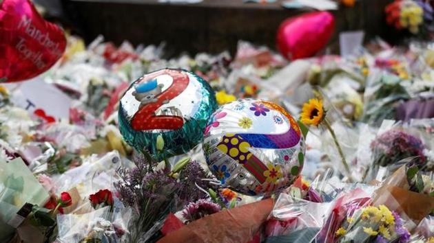 Balloons and floral tributes for the victims of the attack on the Manchester Arena are seen in St Ann's square in Manchester, Britain, on May 24. (Reuters)
