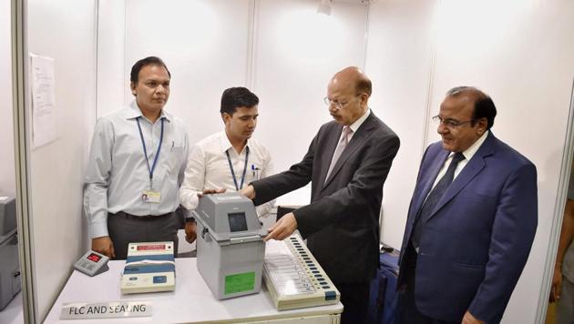 Chief election commissioner Nasim Zaidi and election commissioner AK Joti demonstrate the functioning of electronic voting machines at a press conference on the ‘EVM Challenge’ at Vigyan Bhawan in New Delhi recently. (PTI photo) Chief election commissioner Nasim Zaidi and election commissioner AK Joti demonstrate the functioning of electronic voting machines at a press conference on the ‘EVM Challenge’ at Vigyan Bhawan in New Delhi recently. (PTI photo)