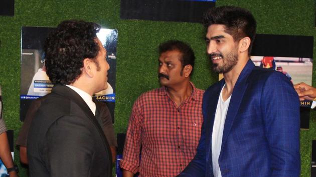 Boxer Vijender Singh greets Sachin Tendulkar before the screening at the premiere of ‘Sachin:A Billion Dreams’ at PVR Icon in Andheri, Mumbai, on Wednesday. (prodip guha)