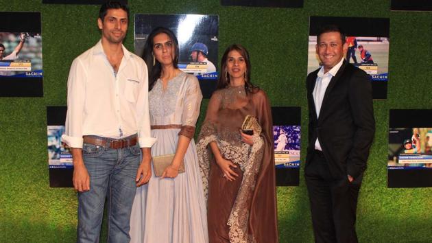 Aashish Nehra and Ajit Agarkar (right) -- both former teammates of Sachin Tendulkar -- arrive with their partners at the premiere of ‘Sachin:A Billion Dreams’ at PVR Icon in Andheri, Mumbai, on Wednesday. (prodip guha)
