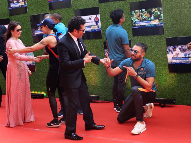 Yuvraj Singh, who has played with Sachin Tendulkar for Indian cricket team, salutes the Master in trademark style, at the premiere of ‘Sachin:A Billion Dreams’ at PVR Icon in Andheri, Mumbai, on Wednesday. (prodip guha)