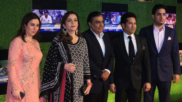 Mukesh Ambani (centre), wife Nita Ambani (2nd left), and son Akash Ambani greet Sachin Tendulkar at the premiere of ‘Sachin:A Billion Dreams’ at PVR Icon in Andheri, Mumbai, on Wednesday. (prodip guha)