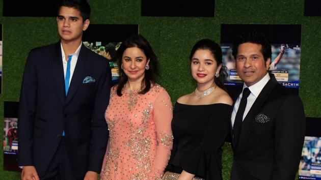Sachin Tendulkar with his family -- son Arjun Tendulkar, wife Anjali and daughter Sara at the premiere of his biopic, ‘Sachin: A Billion Dreams’ in Mumbai on Wednesday. (prodip guha)