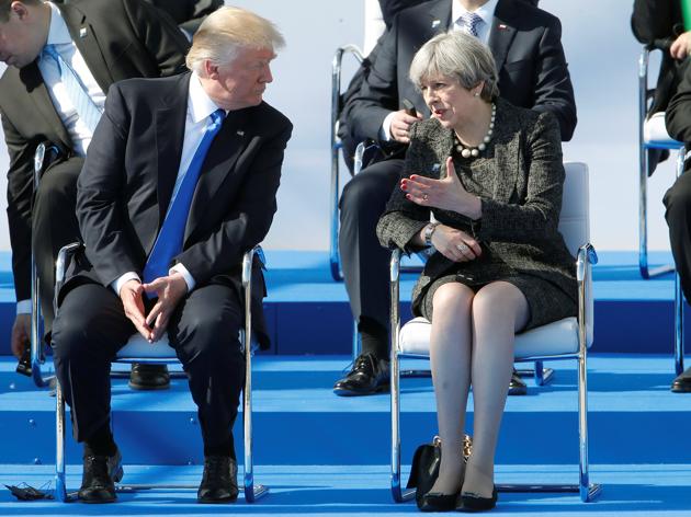 U.S. President Donald Trump (L) and Britain's Prime Minister Theresa May react during a ceremony at the new NATO headquarters before the start of a summit in Brussels, Belgium, May 25, 2017. REUTERS/Christian Hartmann(REUTERS)