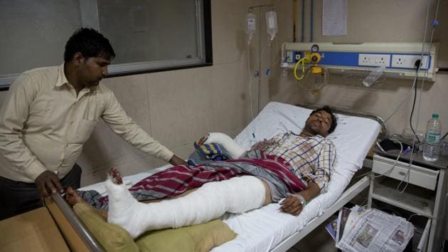 A man attacked by a group of people while returning from a rally, at a government hospital in Meerut, about 65 kilometers from New Delhi on May 24.(AP Photo)