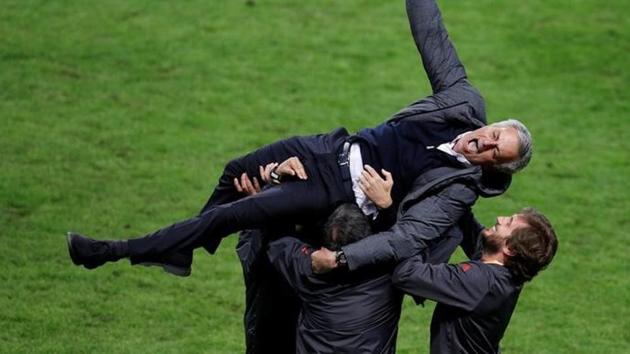 Manchester United manager Jose Mourinho celebrates with coaching staff after the Europa League triumph in Stockholm on Wednesday (reuters)