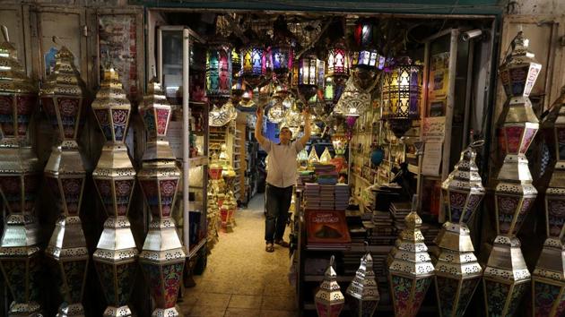 A shopkeeper sells Ramadan lanters, called fanous in the Old city of Jerusalem. (Ammar Awad/REUTERS)