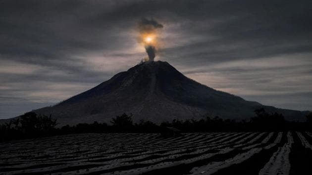 The local disaster agency said that Mt Sinabung, had erupted repeatedly in recent days, pumping hot gas clouds up to 3km into the sky. (TIBTA PANGIN / AFP)
