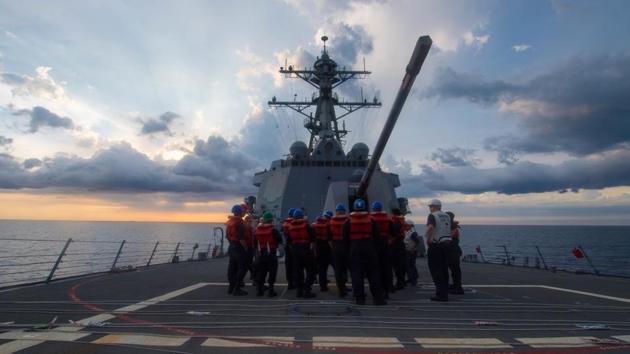 US sailors receive a safety brief on the Arleigh Burke-class guided-missile destroyer USS Dewey prior to a replenishment-at-sea on May 6 in the South China Sea.(AFP File Photo) US sailors receive a safety brief on the Arleigh Burke-class guided-missile destroyer USS Dewey prior to a replenishment-at-sea on May 6 in the South China Sea.(AFP File Photo)