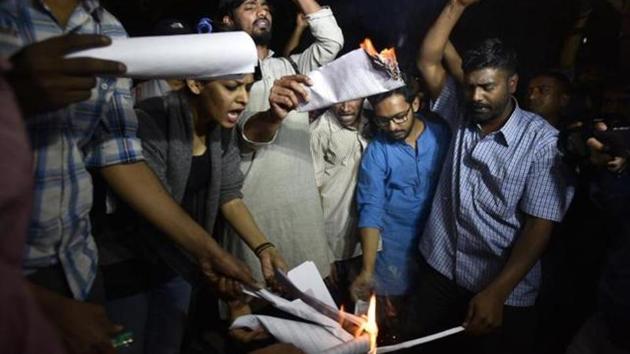 Former ABVP members who left the RSS’ student outfit citing differences over its handling of the JNU row, burn a copy of the Manusmriti, in New Delhi. (HT File Photo) Former ABVP members who left the RSS’ student outfit citing differences over its handling of the JNU row, burn a copy of the Manusmriti, in New Delhi. (HT File Photo)
