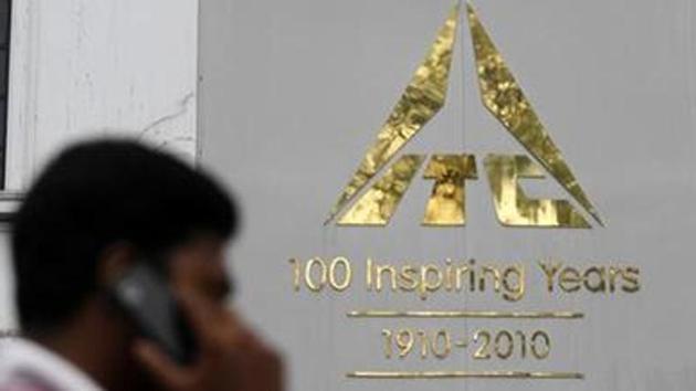A man talks on his mobile phone as he walks past an ITC office building. (Reuters photo) A man talks on his mobile phone as he walks past an ITC office building. (Reuters photo)