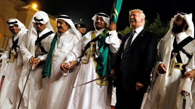 U.S. President Donald Trump dances with a sword as he arrives to a welcome ceremony by Saudi Arabia's King Salman bin Abdulaziz Al Saud at Al Murabba Palace in Riyadh, Saudi Arabia May 20, 2017.(REUTERS)