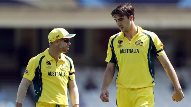 Australia's David Warner (L) in conversation with fast bowler Pat Cummins. (REUTERS) 