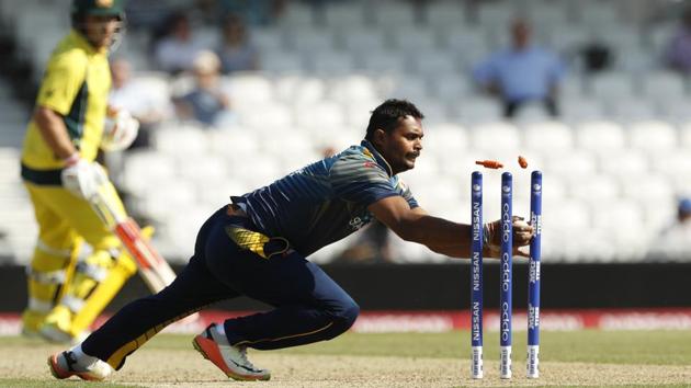 Sri Lanka's Asela Gunaratne takes the wicket of Australia's Moises Henriques. (REUTERS) 