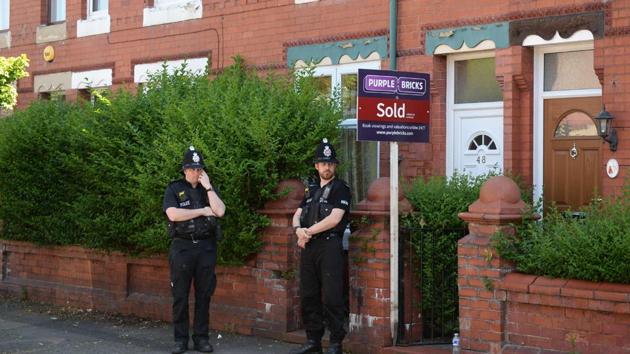 Police stand guard outside a property in Moss Side, Manchester, on May 26, 2017, following a raid on a residential property as investigations continued into the May 22 terror attack at Manchester Arena. Britain is hunting for a Libya-linked jihadi network thought to be behind the bombing at an Ariana Grande concert that killed 22 people. (AFP) Police stand guard outside a property in Moss Side, Manchester, on May 26, 2017, following a raid on a residential property as investigations continued into the May 22 terror attack at Manchester Arena. Britain is hunting for a Libya-linked jihadi network thought to be behind the bombing at an Ariana Grande concert that killed 22 people. (AFP)